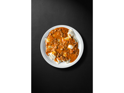 Ravioles con salsa boloñesa