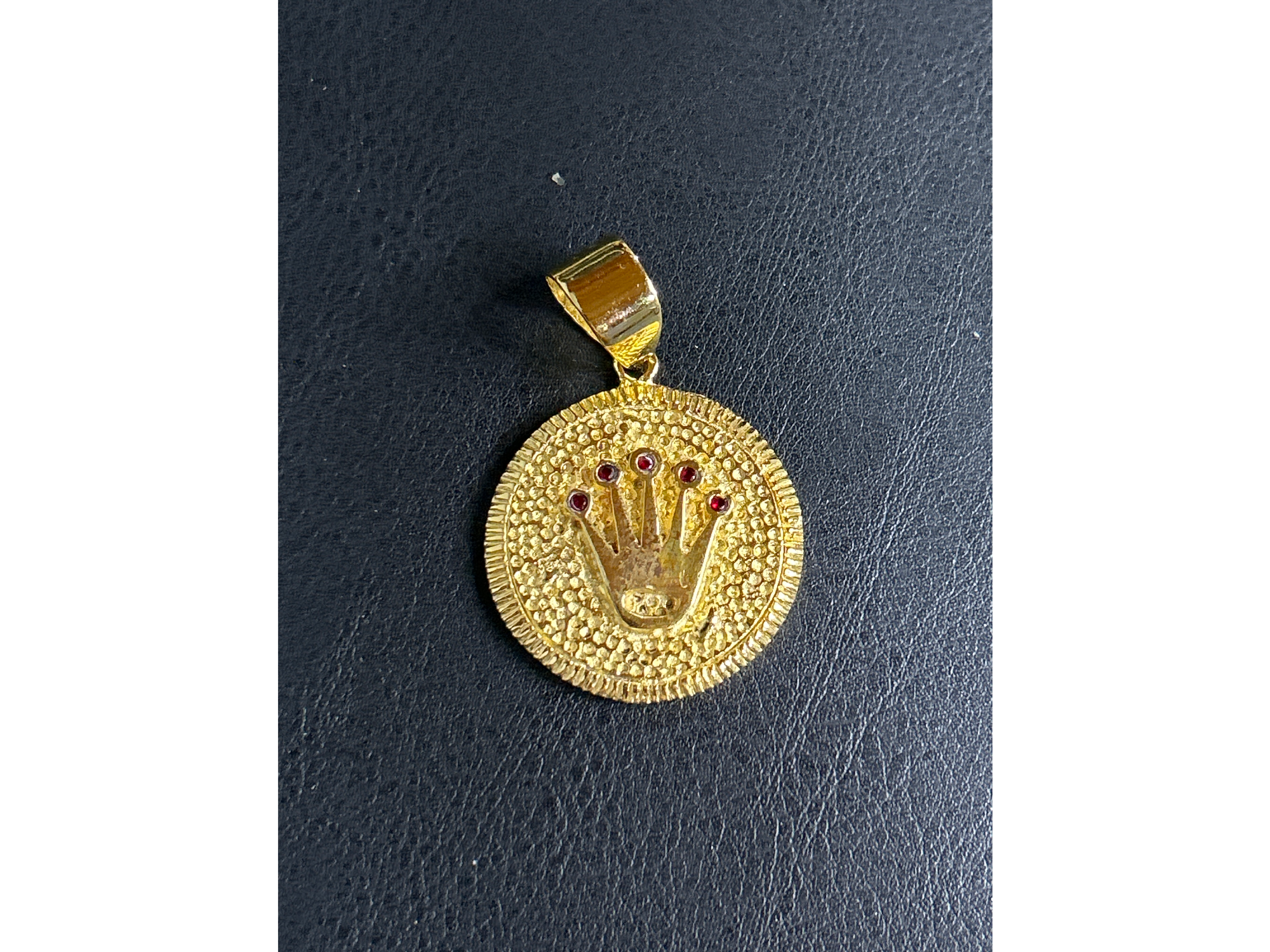 Medalla rolex con piedras