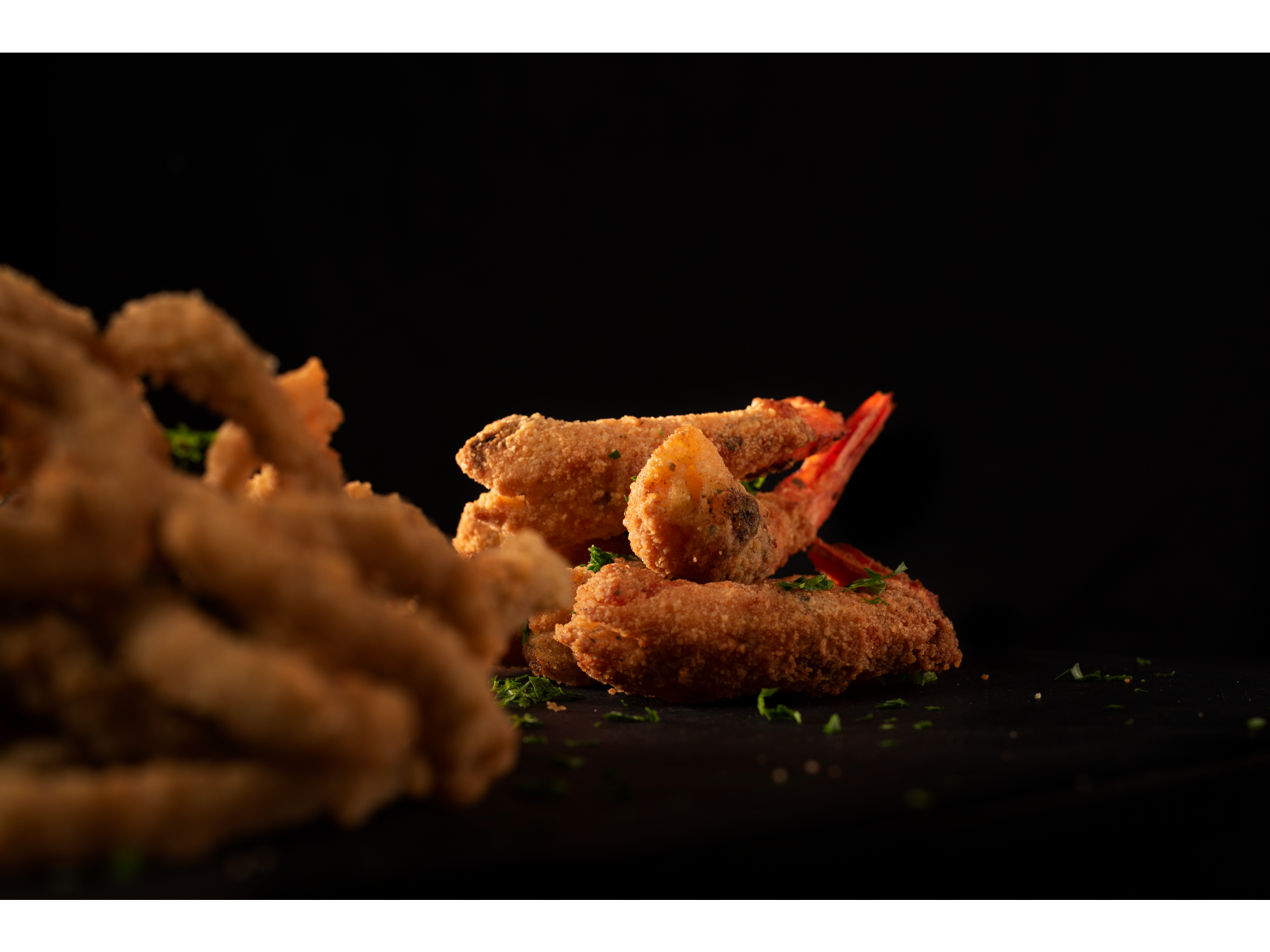 Porción de langostinos fritos