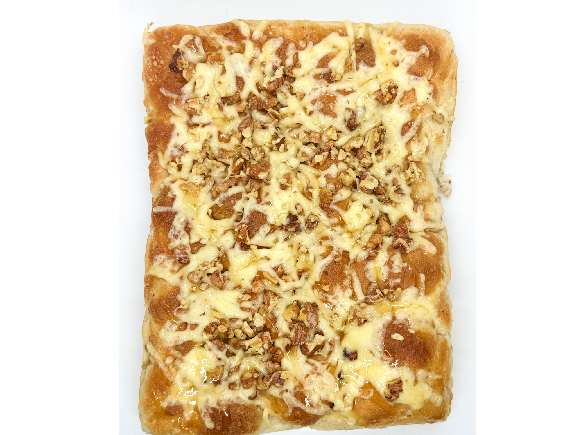 Focaccia PORCION matera: reggianito, nuez y miel