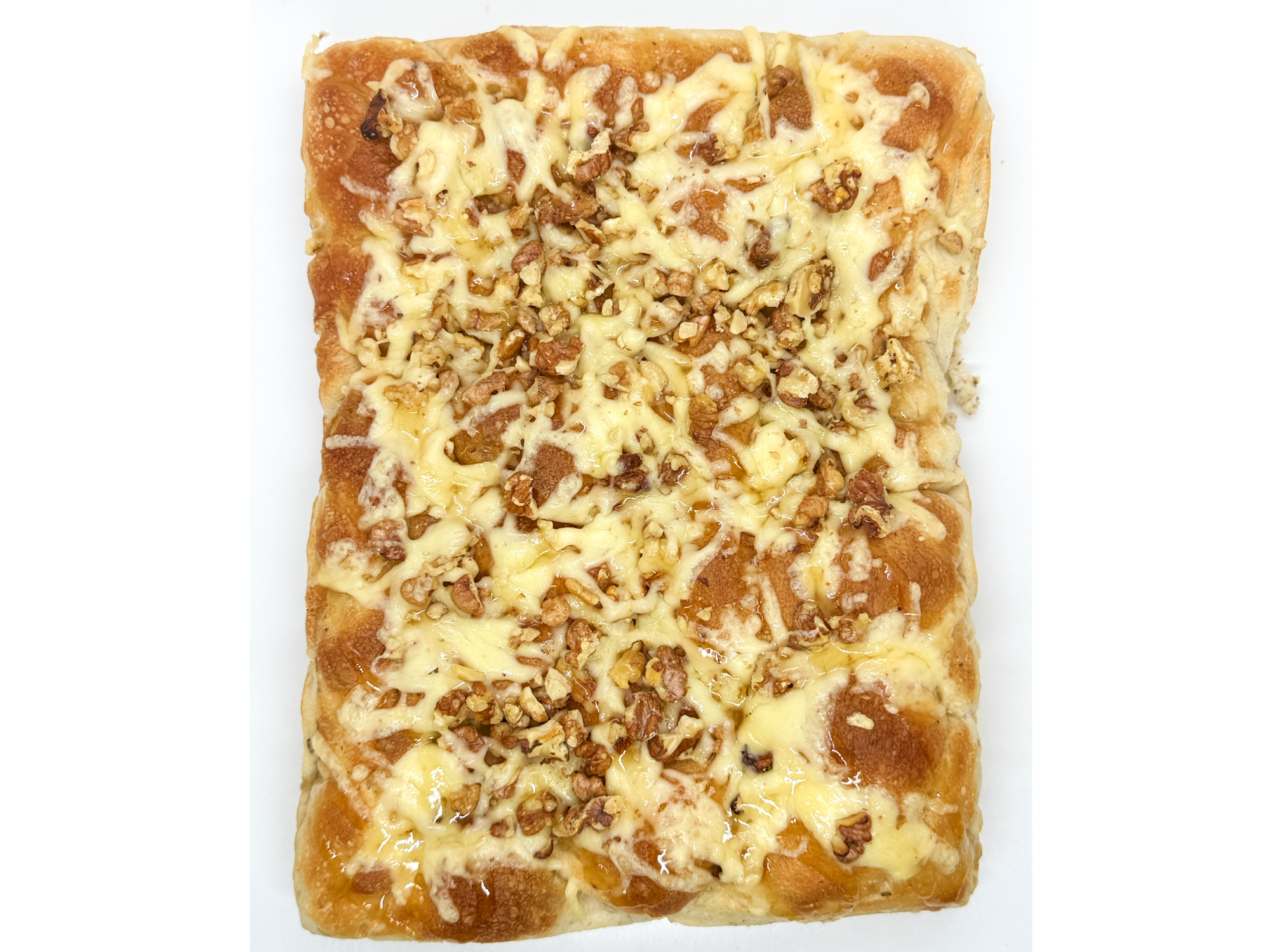 Focaccia entera matera: reggianito, nuez y miel