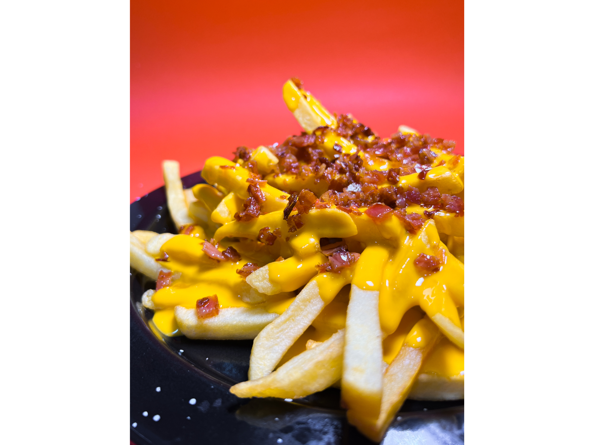 Papas con cheddar y bacon