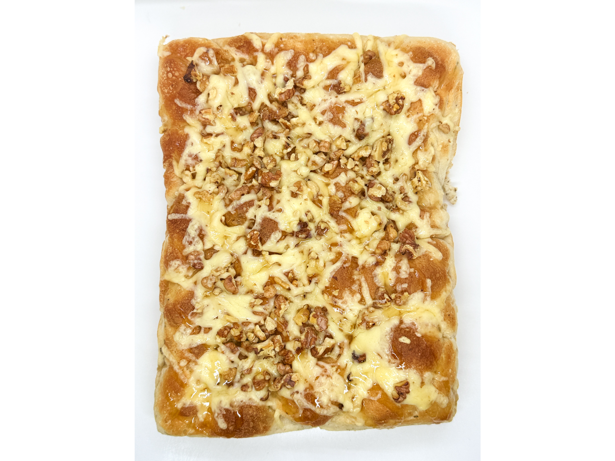 Focaccia PORCIÓN matera: reggianito, nuez y miel