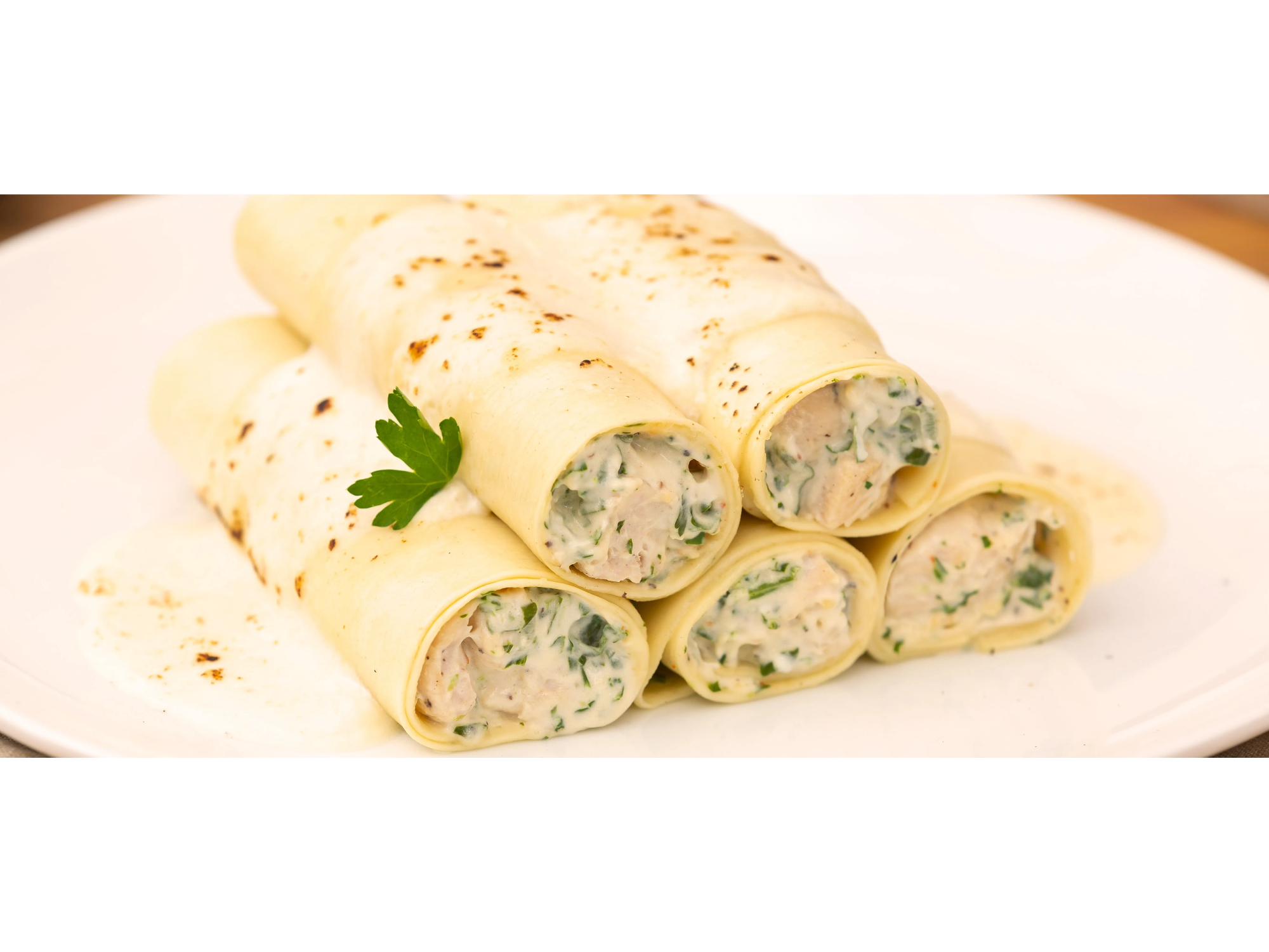 Canelones de verdura y ricota con salsa a elecciòn