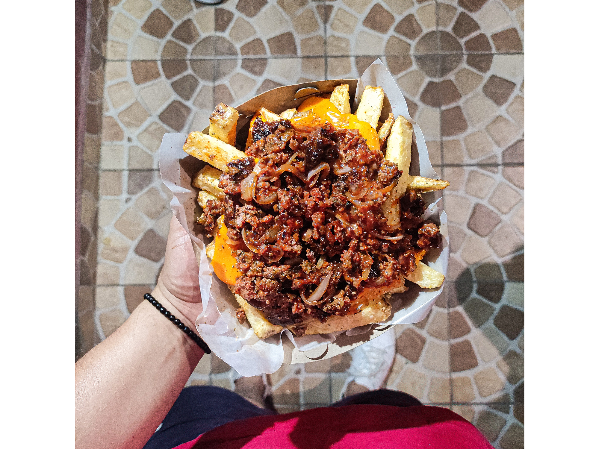 Papas con cheddar y carne picante