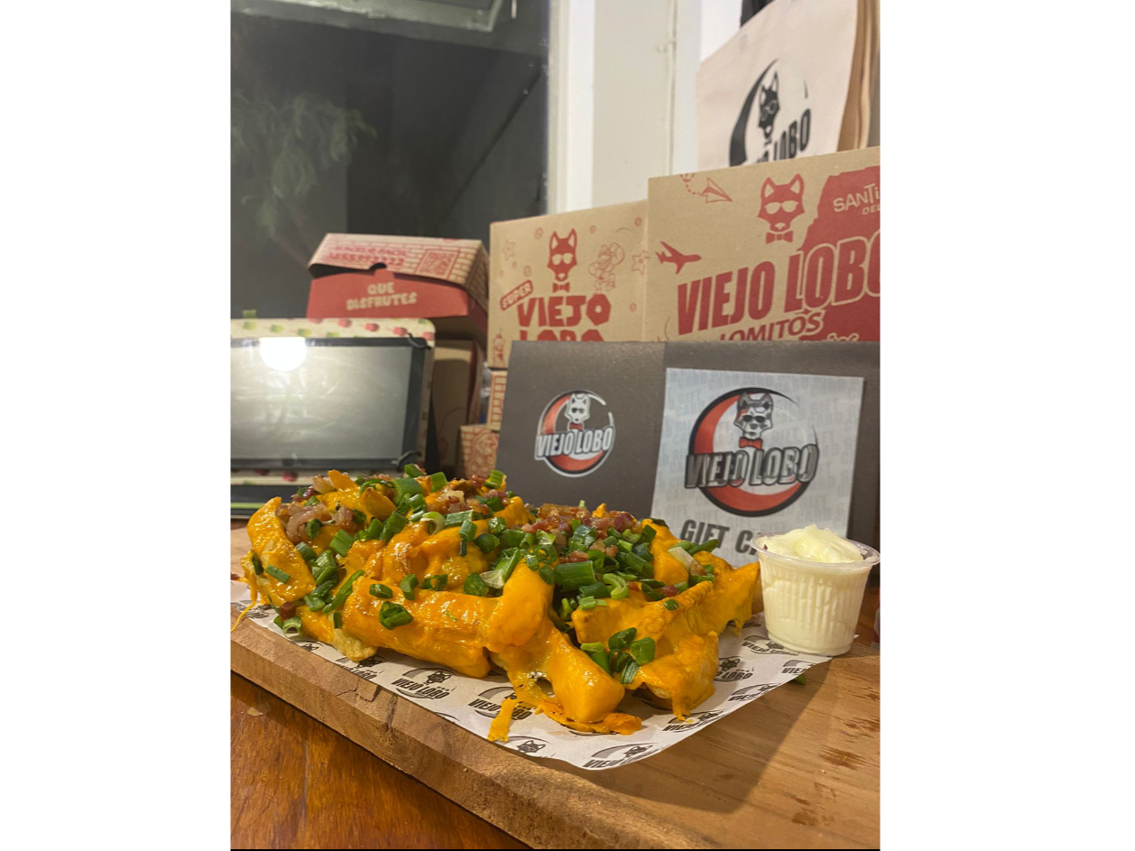 Papas Gratinadas Cheddar , Panceta + Verdeo