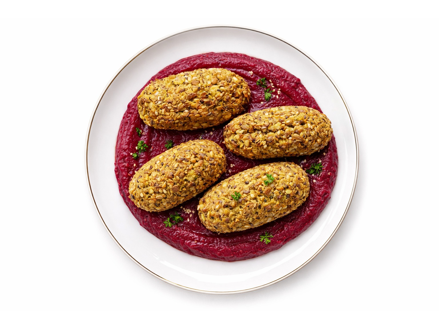 Bastones de lentejas zanahori y semillas con cremoso de remolacha