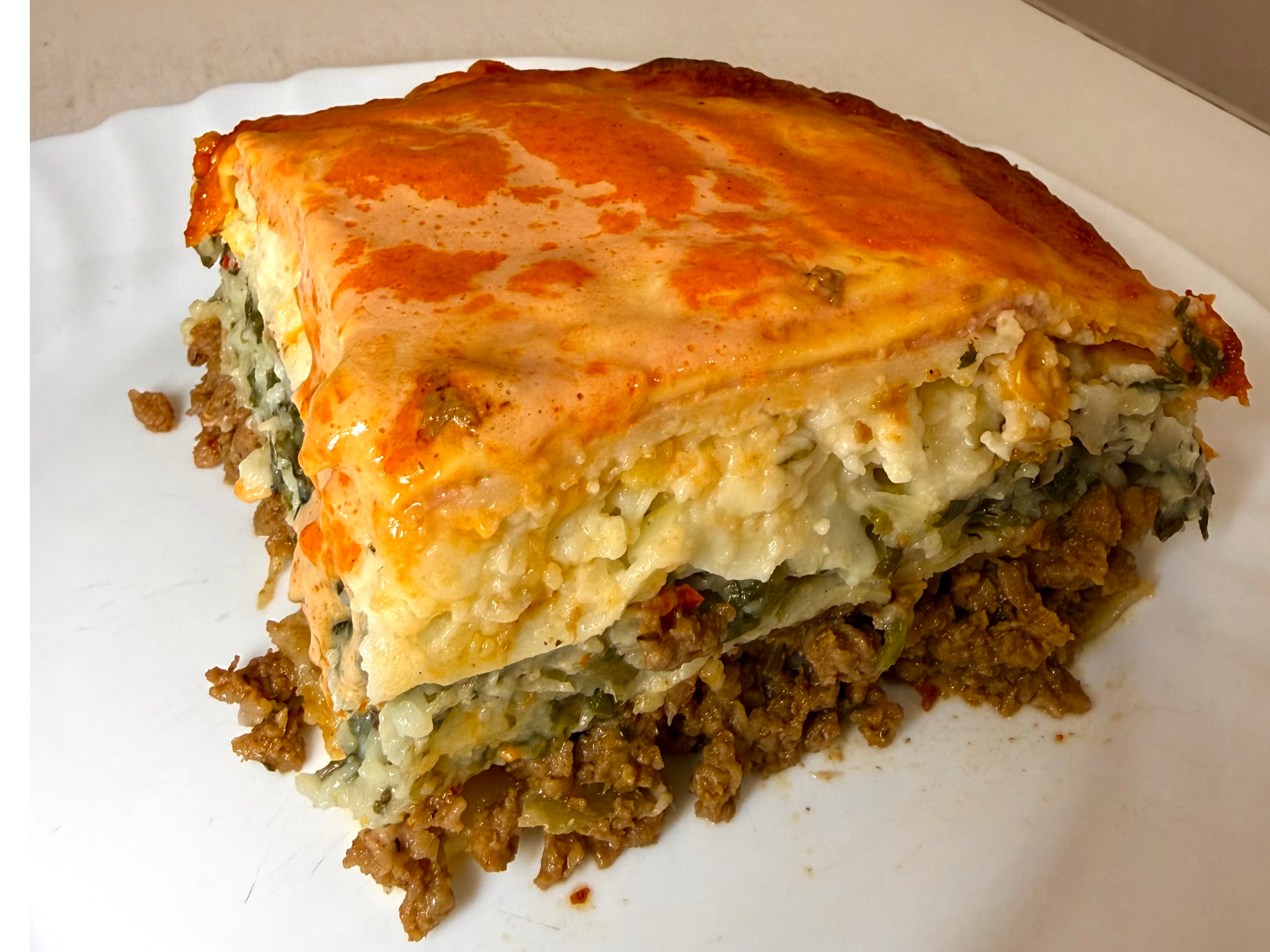 Porción lasagna mixta