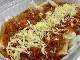 Ravioles con Bolognesa