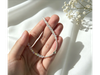 Cristal bicono blanco tornazolado con dije estrella CHO003