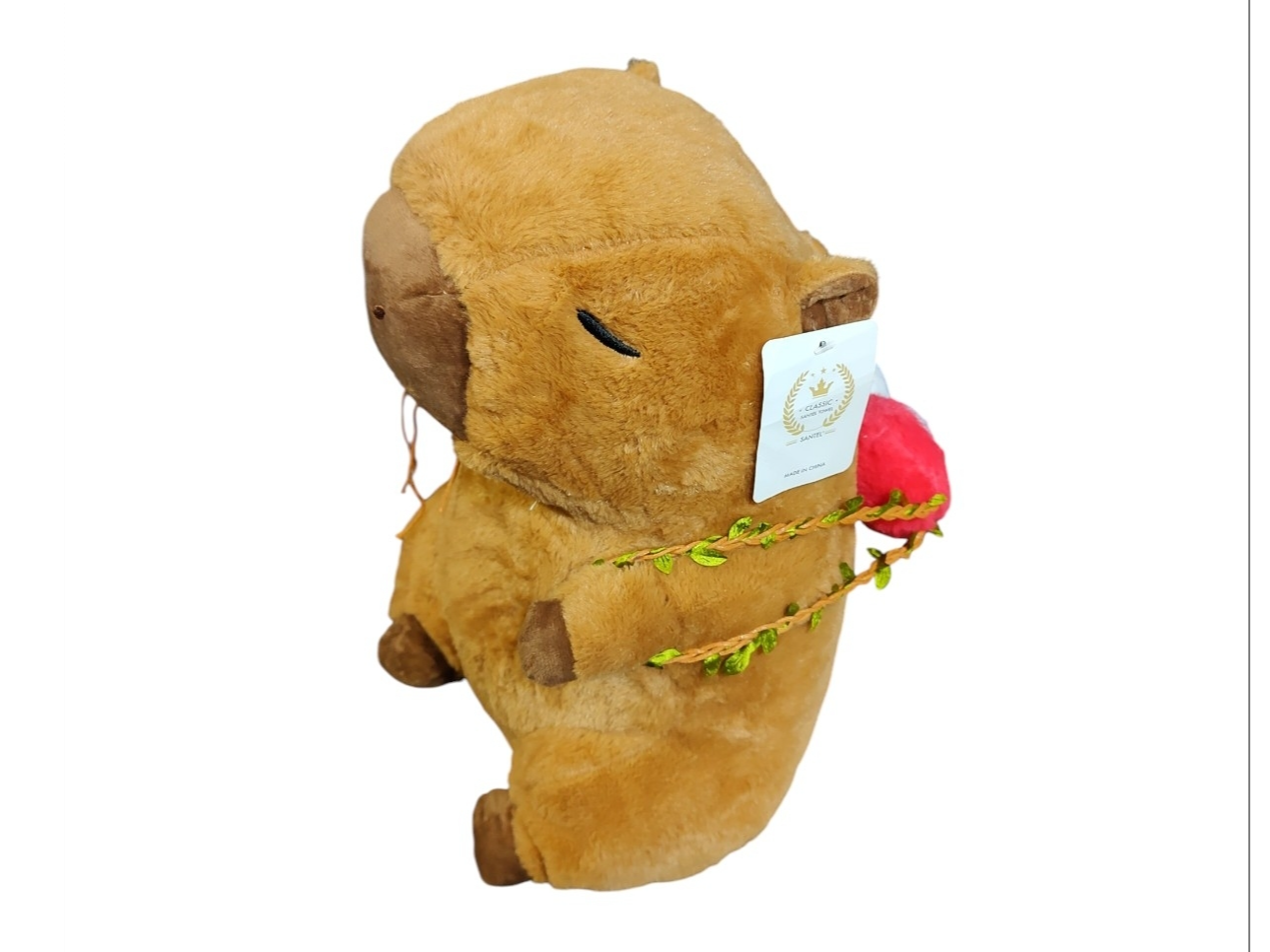 Peluche capibara c/manta y mochila manzana