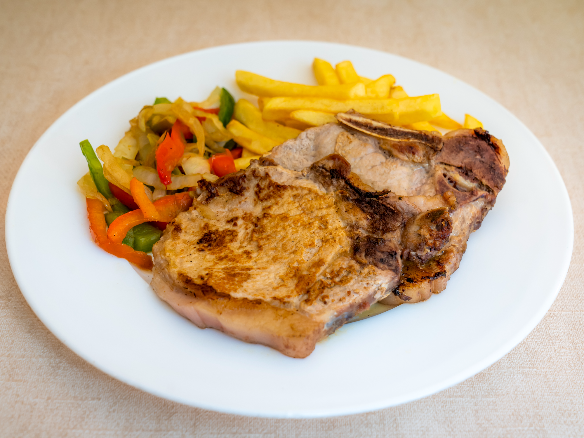 Costeleta de Cerdo + Guarnición