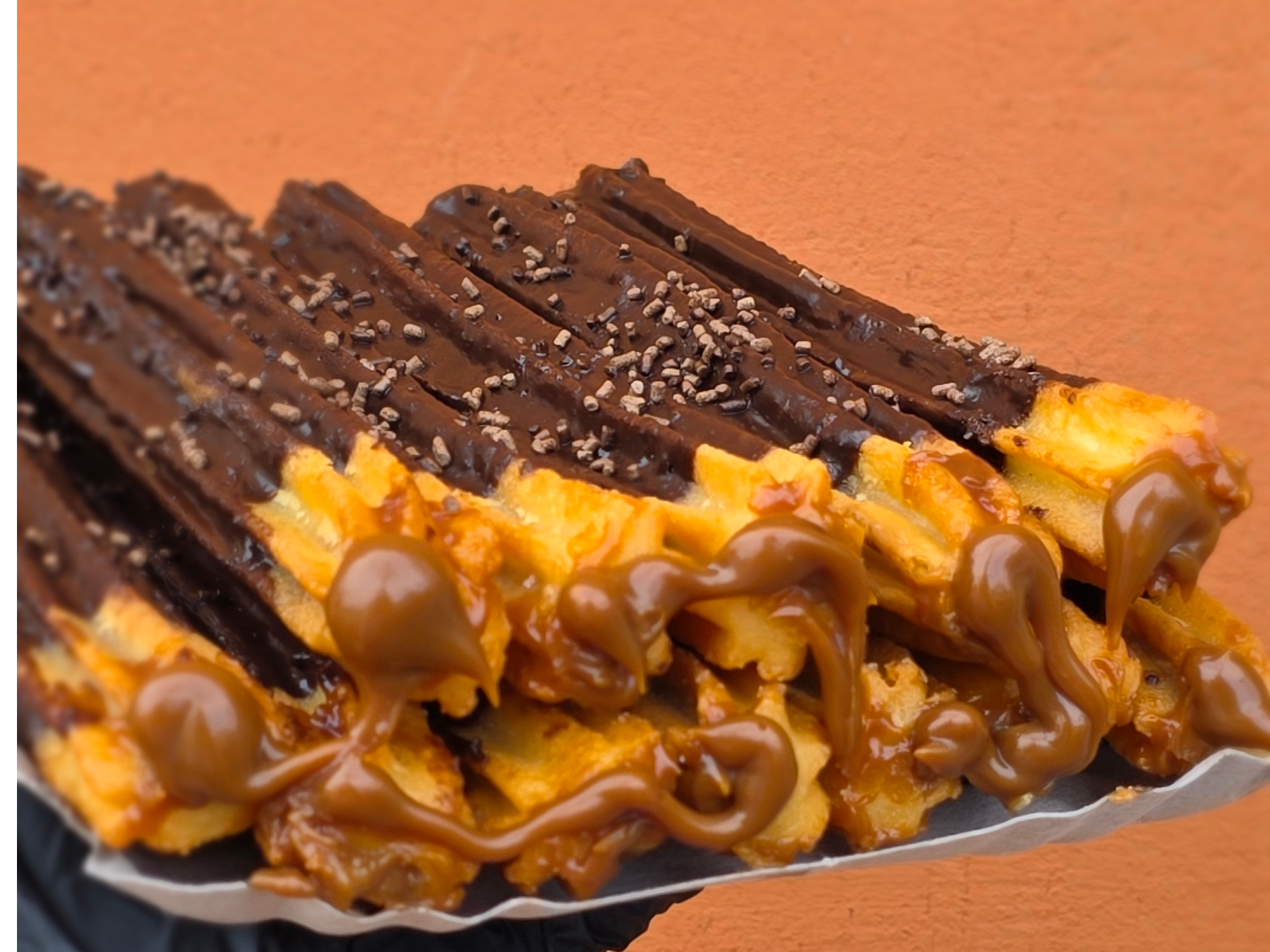 Churros Bañados en Chocolate Rellenos de dulce de leche 1 docena