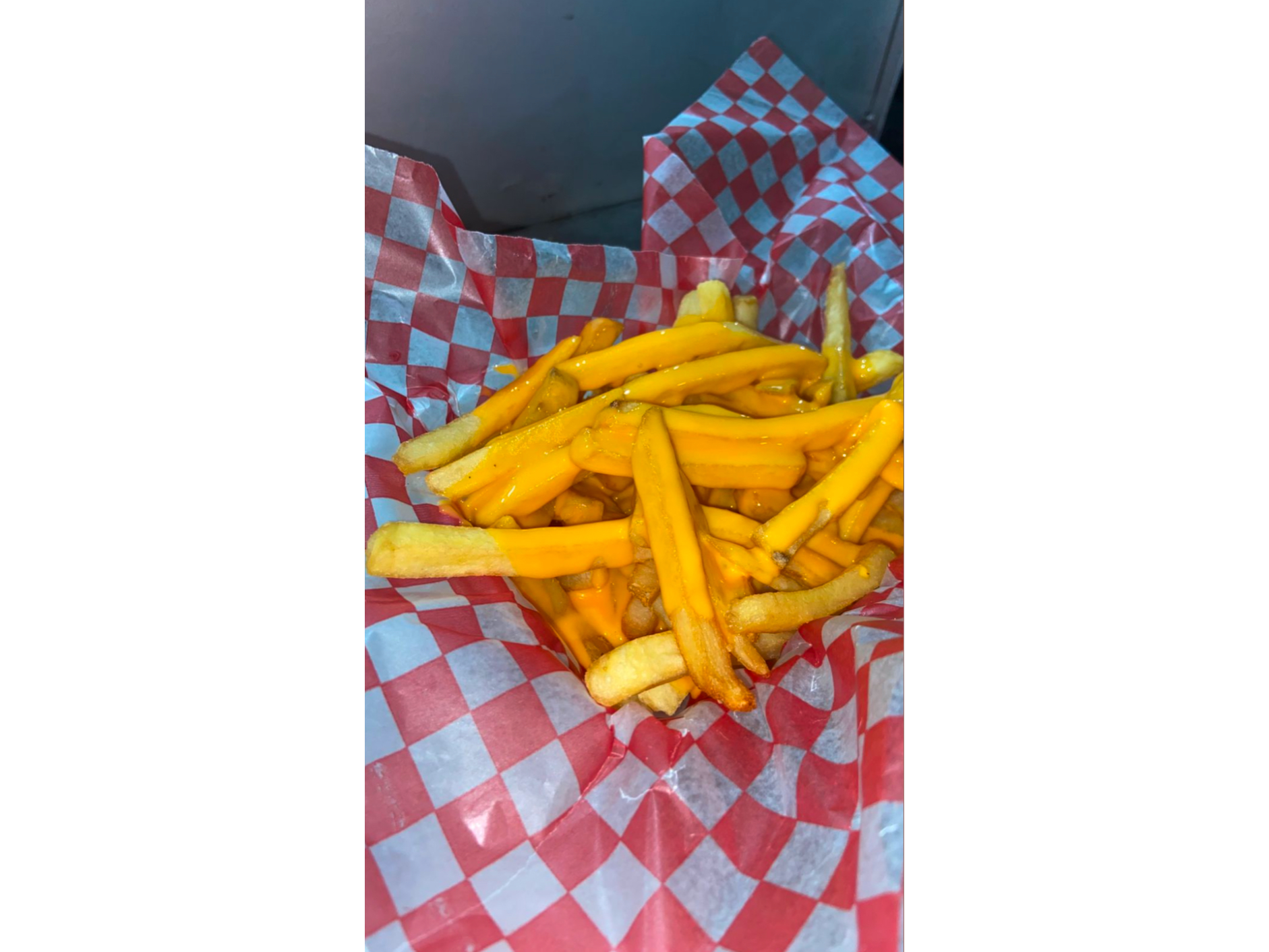 Porción de papas con chedar