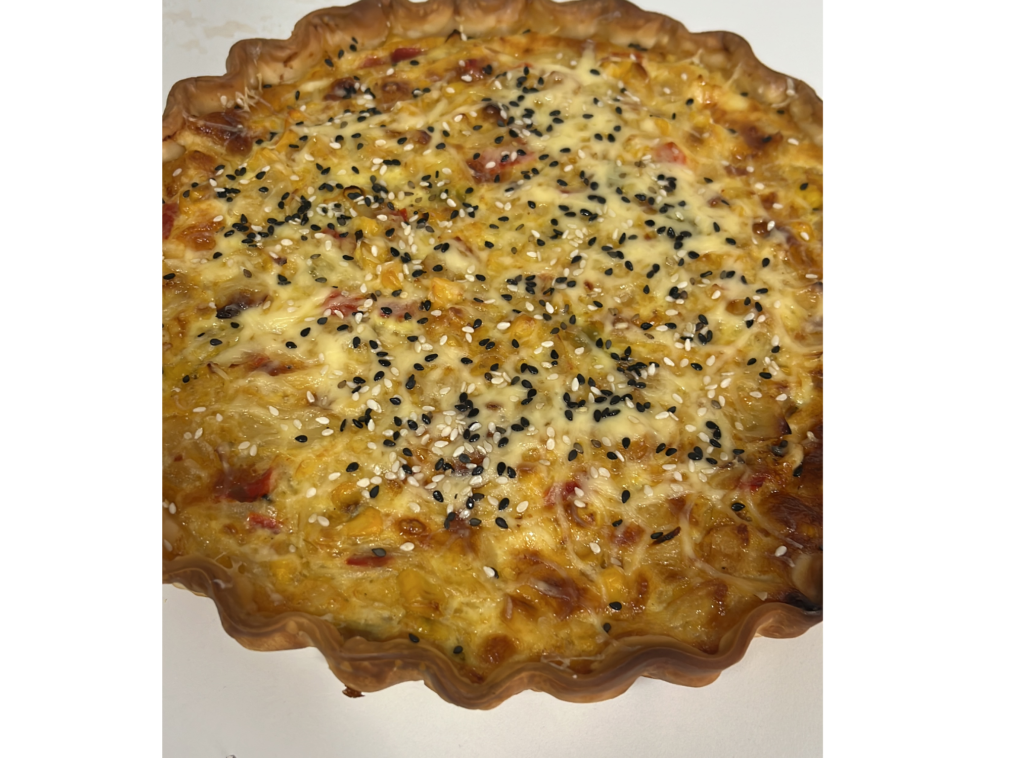 Choclo, cebolla salteada, pimiento y queso