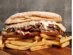 2 Entre Panes Atracon + 2 Porciones de papas +2 Latas de Gaseosa