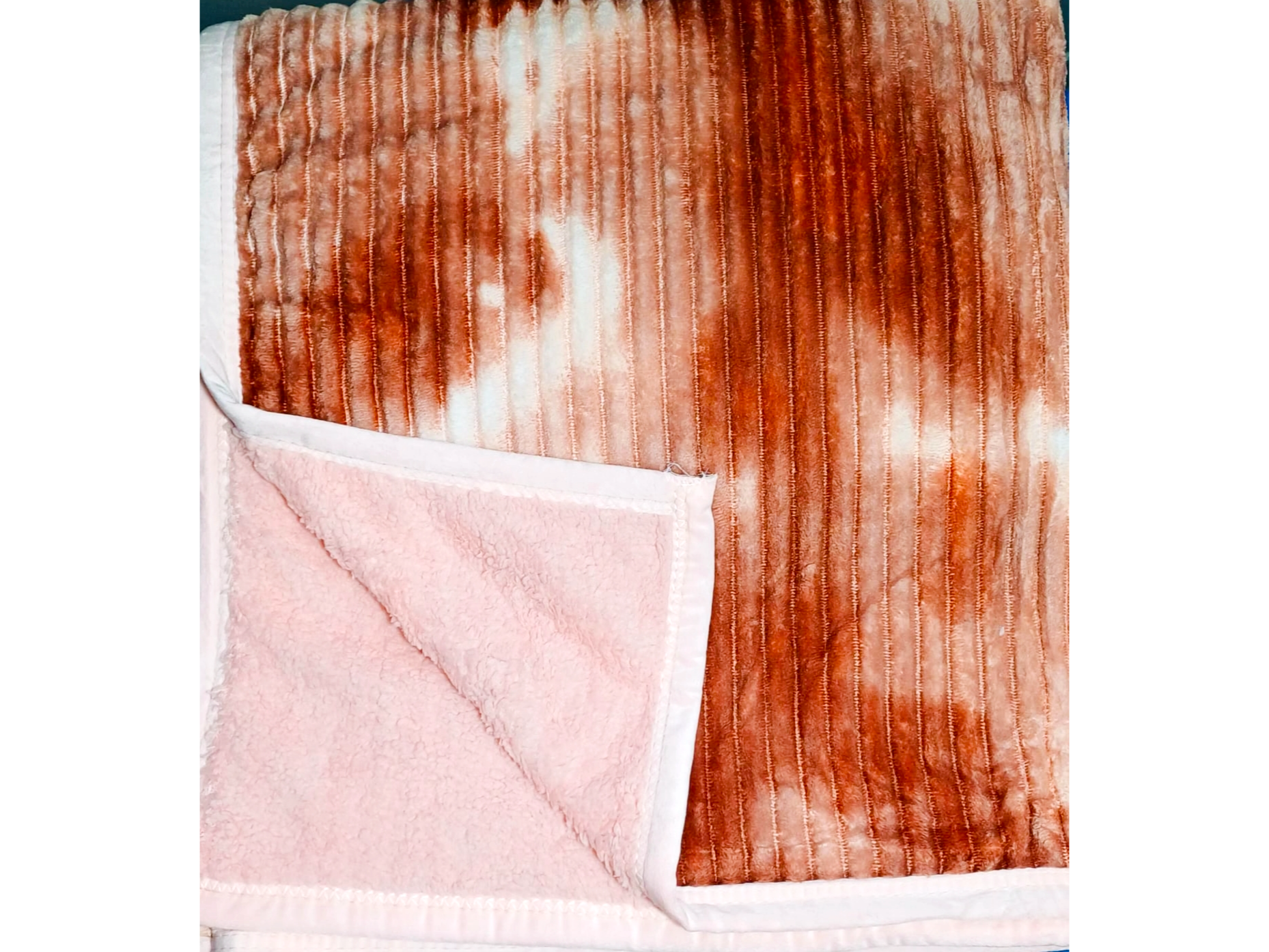 Manta con corderito veteada de color naranja