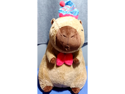 Peluche CAPIBARA con manta con Moño Rojo