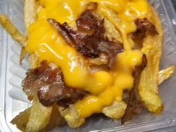 Porción de Fritas con Cheddar y Bacon
