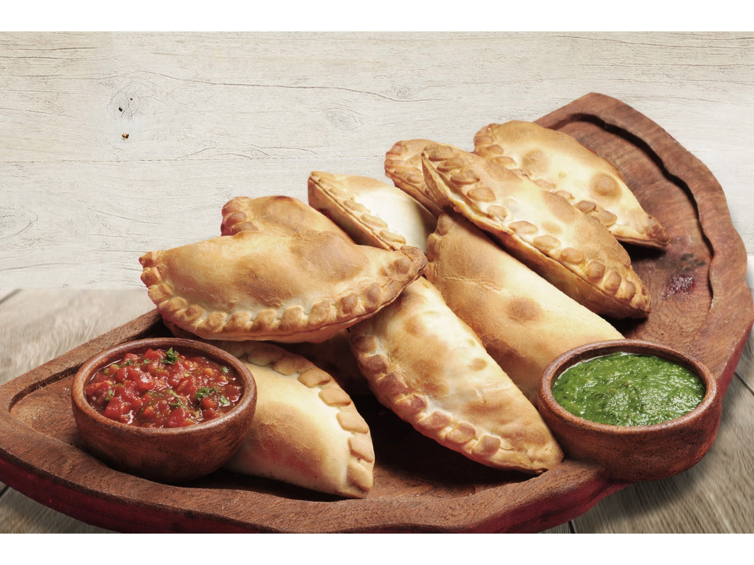 12 empanadas + 2 salsas (Promo efectivo)