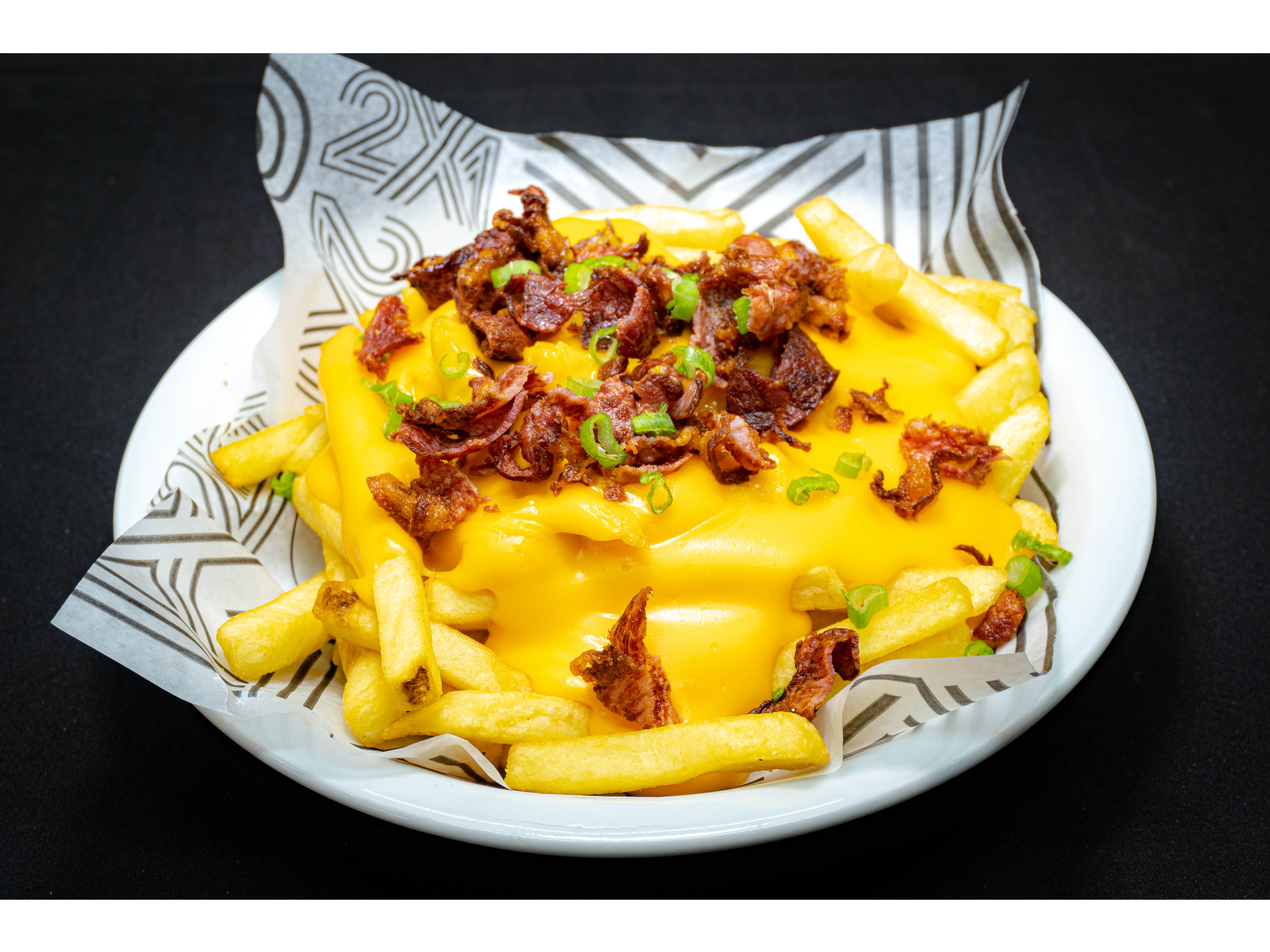 Porción de Papas con Cheddar y Bacon