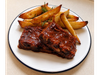 RIBS DE CERDO A LA BARBACOA CON PAPAS CUÑAAL HORNO