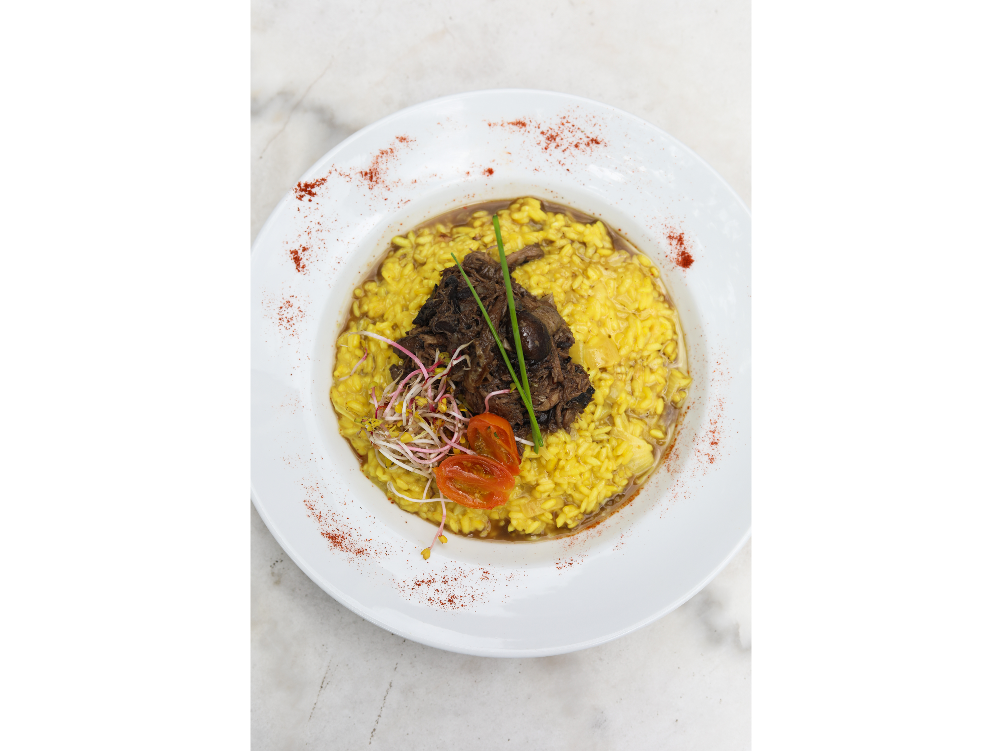 Risotto allá milanese con ragú de cerdo