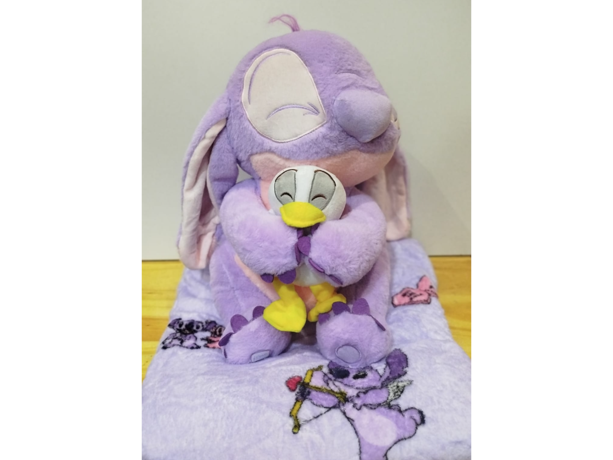 Peluche con manta Stitch lila