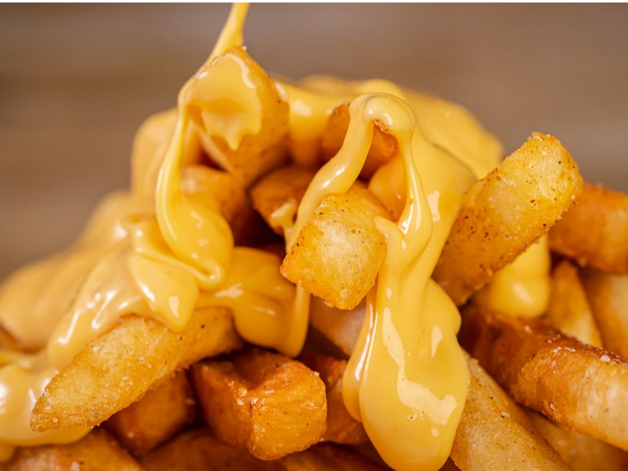 Papas fritas con cheddar