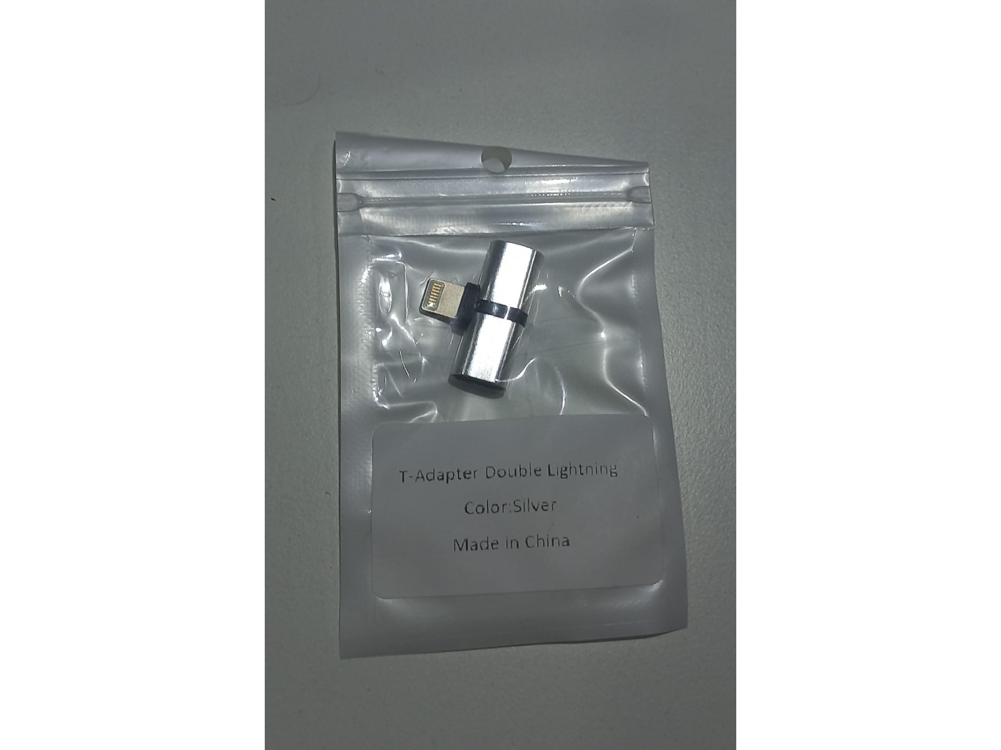 Adaptador lightning macho a 2 hembras