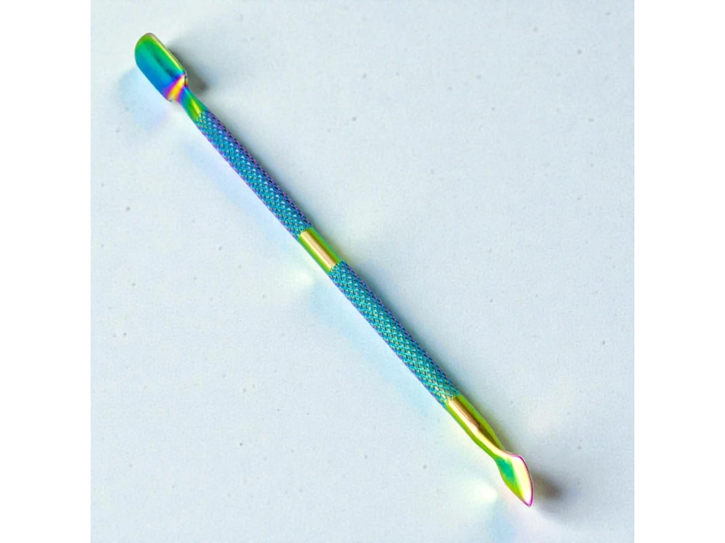 REPUJADOR DE CUTICULA COLOR TORNASOL MELY