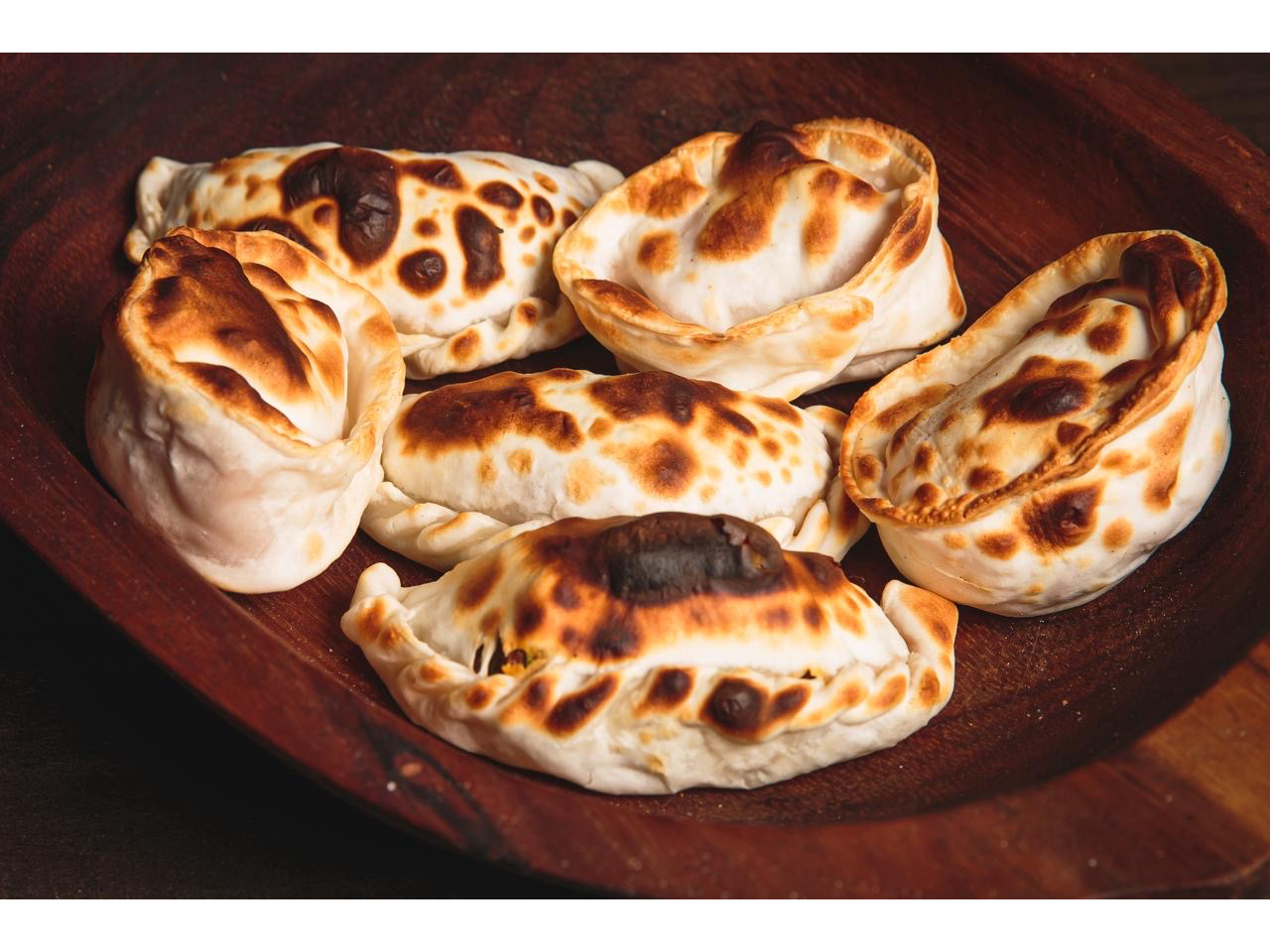 Docena de empanadas de jamón y queso