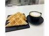 Infusión + media plancha de tostado con jamón y queso