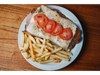 MILANESA DE POLLO A LA NAPOLITANA CON PAPAS + LATA O AGUA