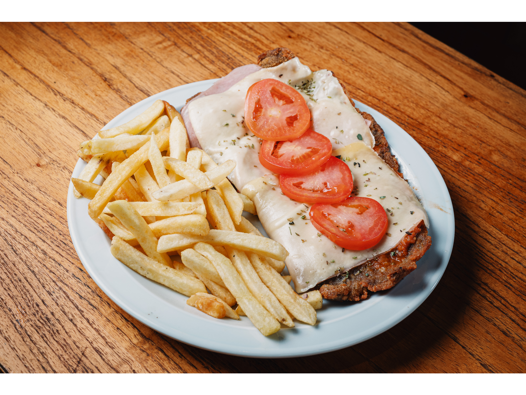 MILANESA A LA NAPOLITANA CON GUARNICION de TOPPING BURGER CERRO
