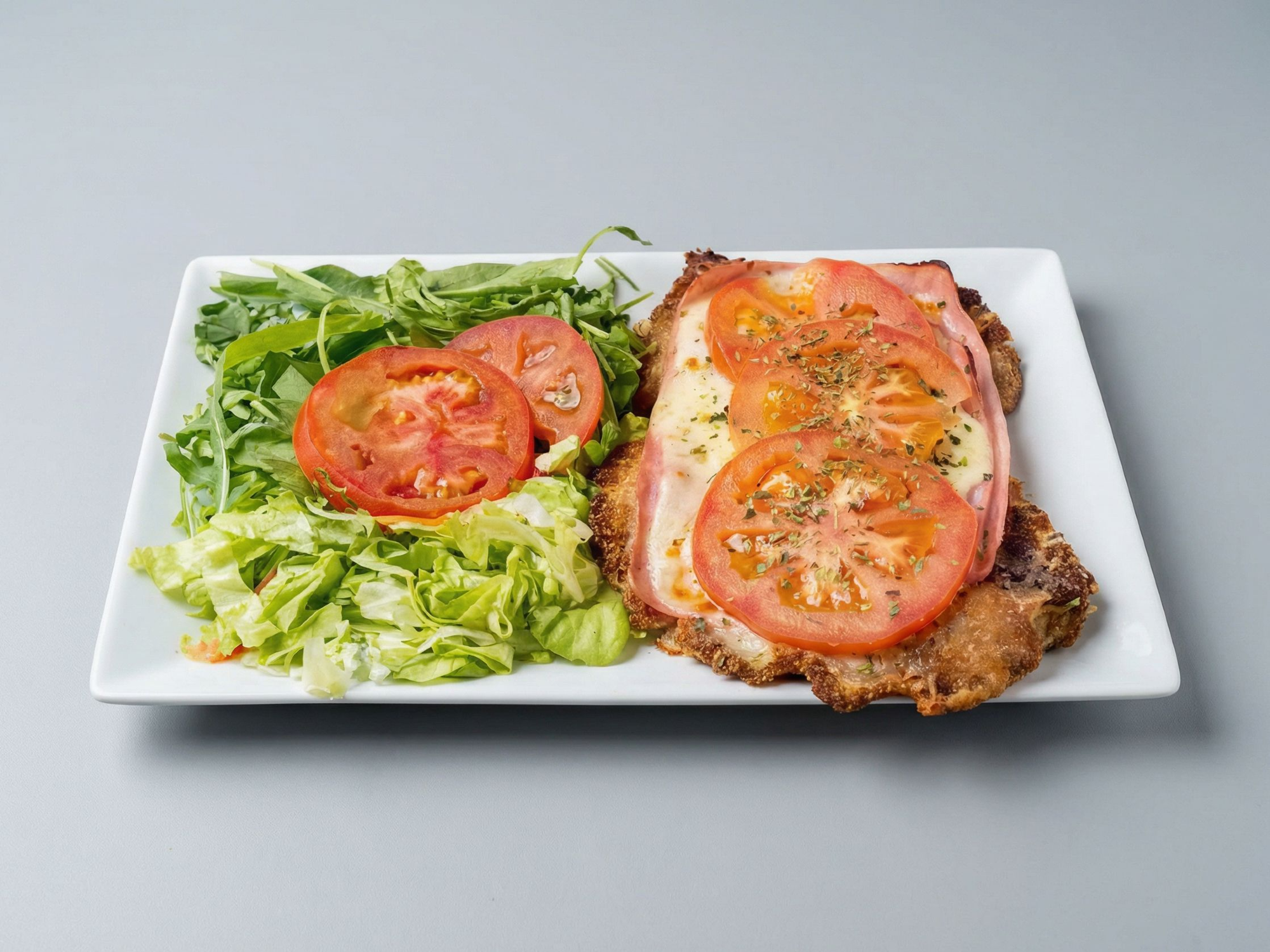 Mila de pollo napo/jamon con ensalada