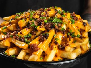 Papas cheddar y verdeo para compartir