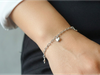 Pulsera con dijes de estella y corazón plateado CM