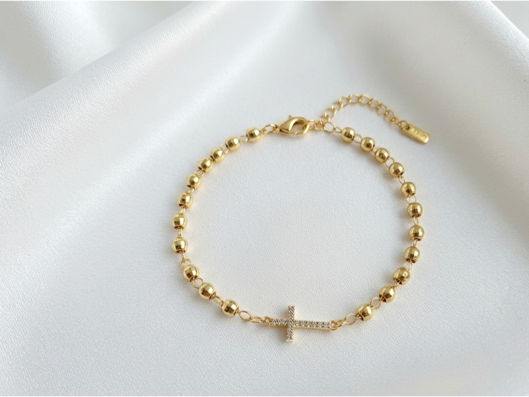 Pulsera dorada CM con dije Cruz con cristales baño 14k