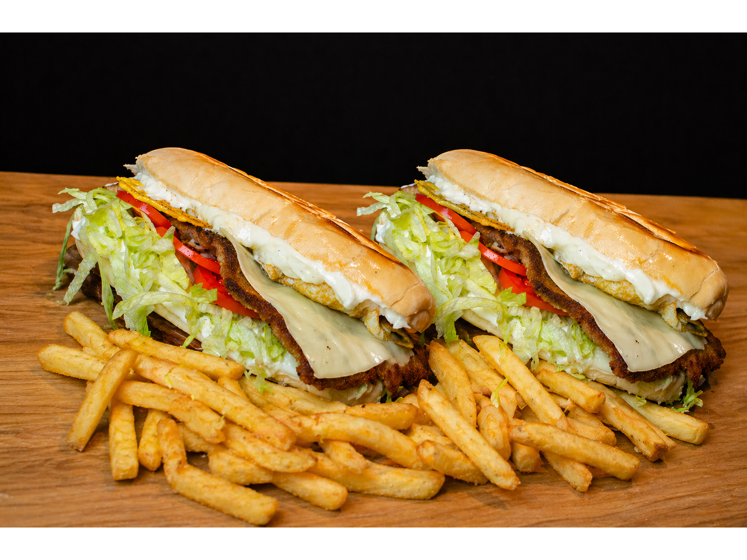 2 Sandwich de milanesa + papas.