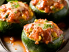 14. Zapallitos rellenos con carne con salsa napolitana y queso.
