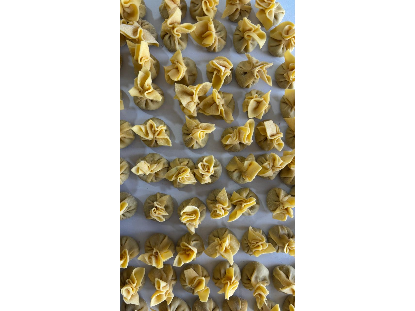 Sacchettini de osobuco, cebolla caramelizada Y reggianito