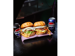 2 Burguer Clasica + 2 Gaseosas Lata