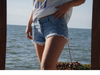 MINI SHORT TIRO MEDIO CELESTE LOCALIZADO