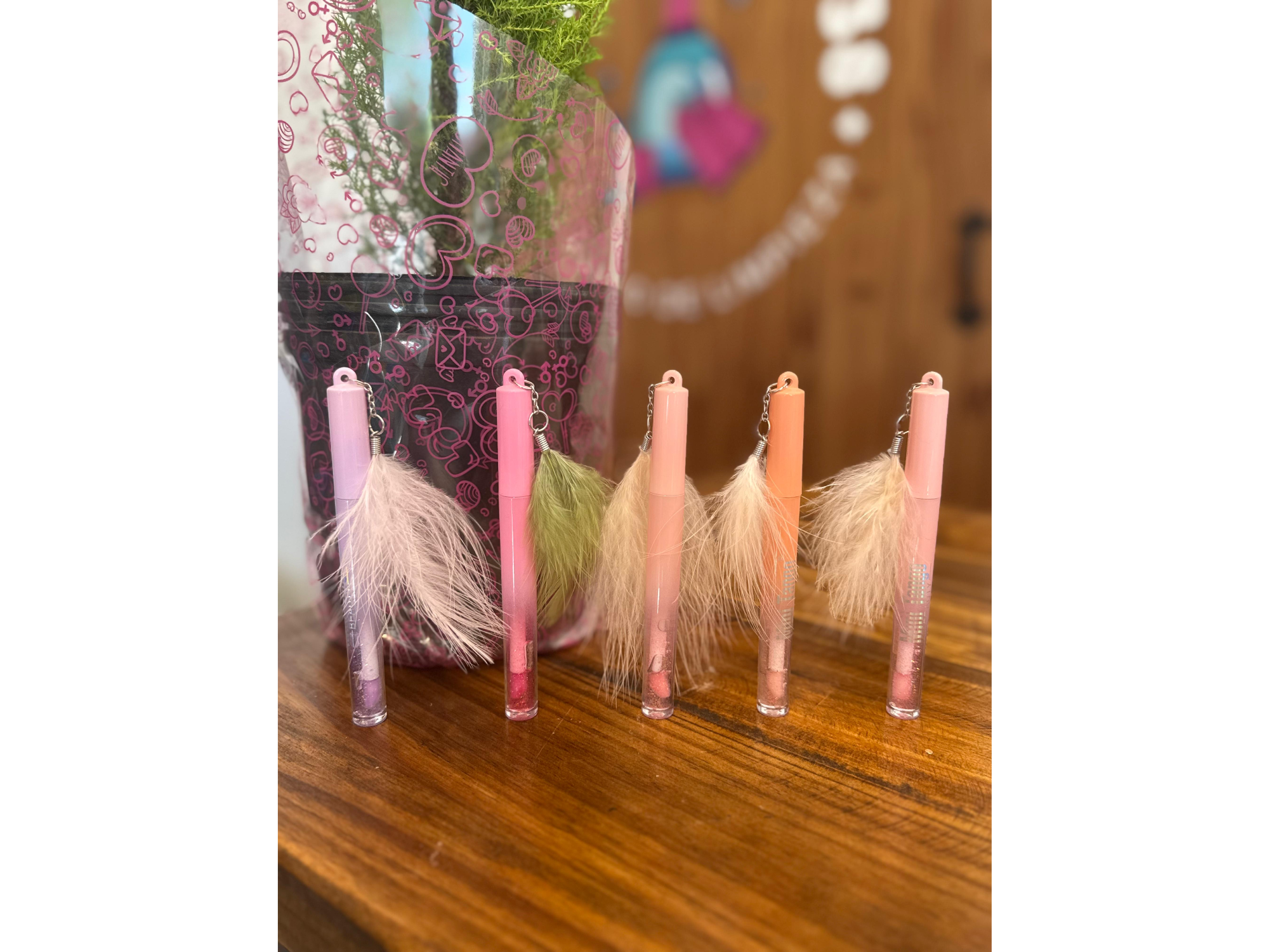 Aceite labial plumas