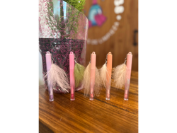 Aceite labial plumas