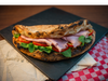 Panuozzo Rucula, tomate y jamon cocido