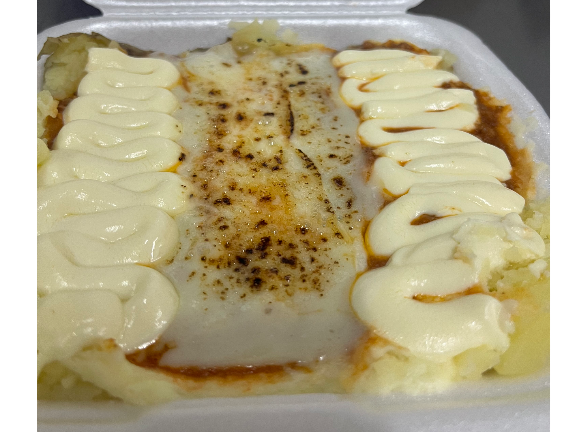 Papas rellenas de carne a la boloñesa
