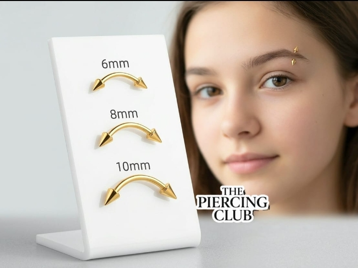 Piercing de cejas dorado con punta