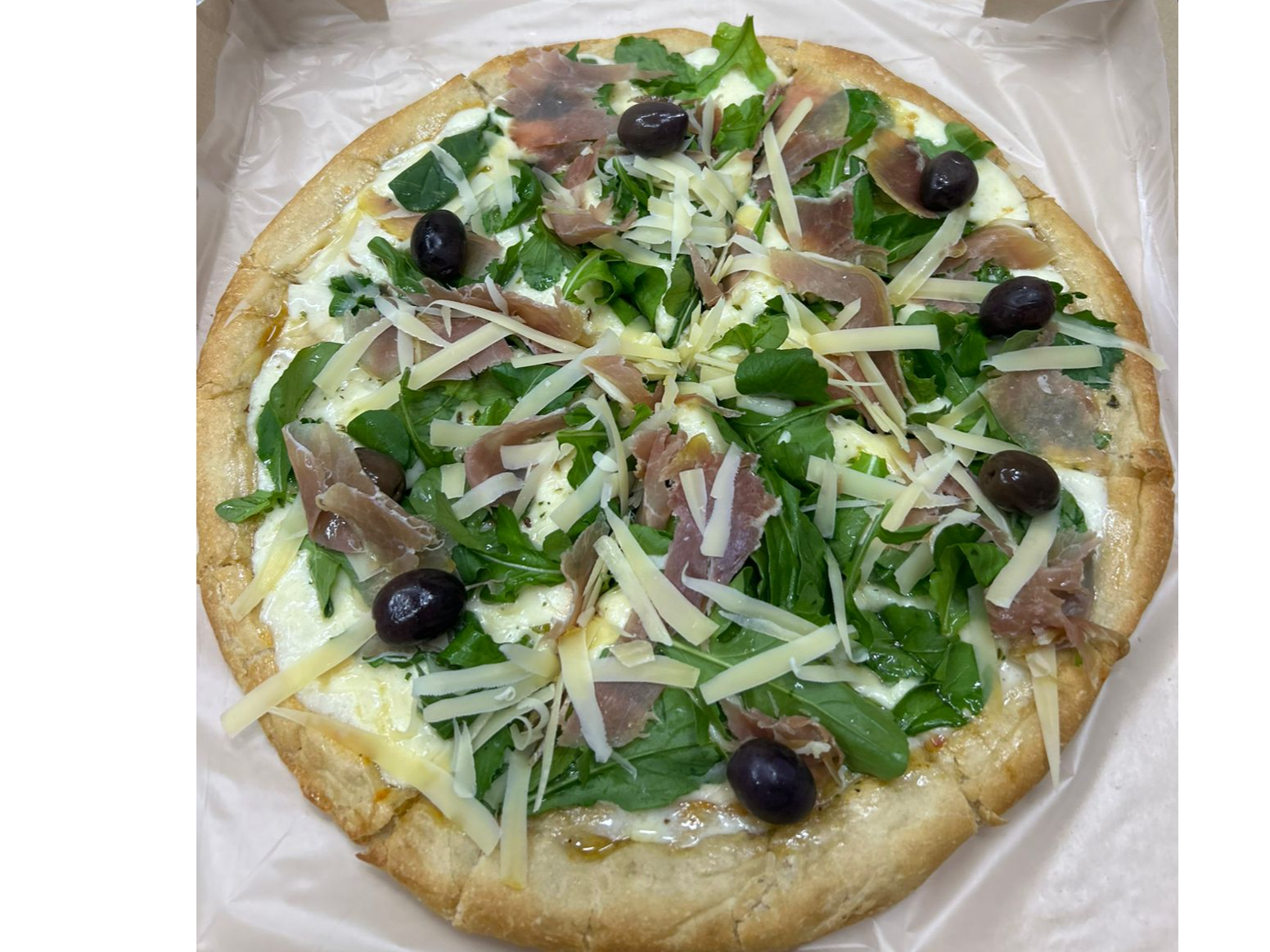 Pizza de Rúcula y Jamón Crudo.